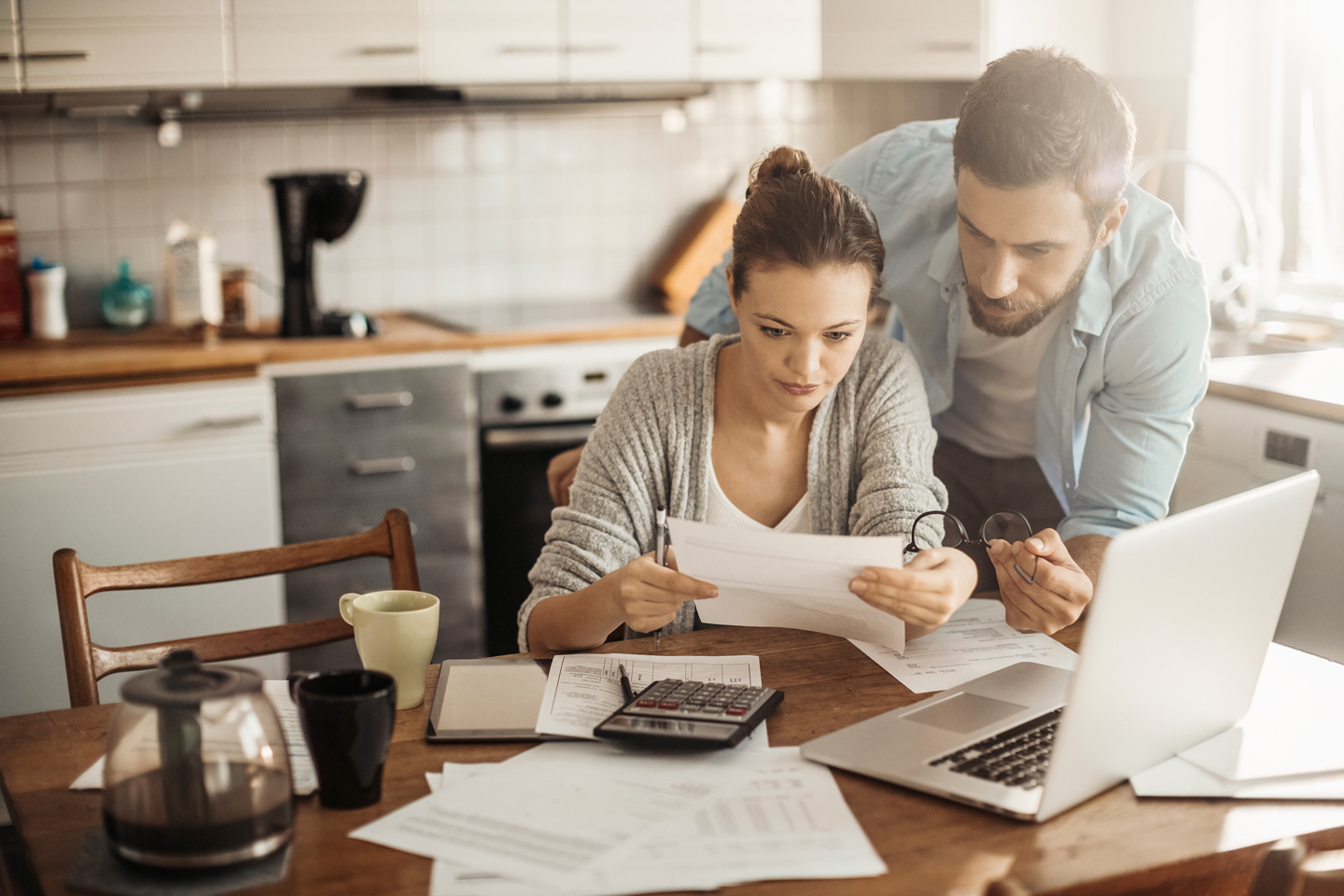 Young couple reviewing their budget