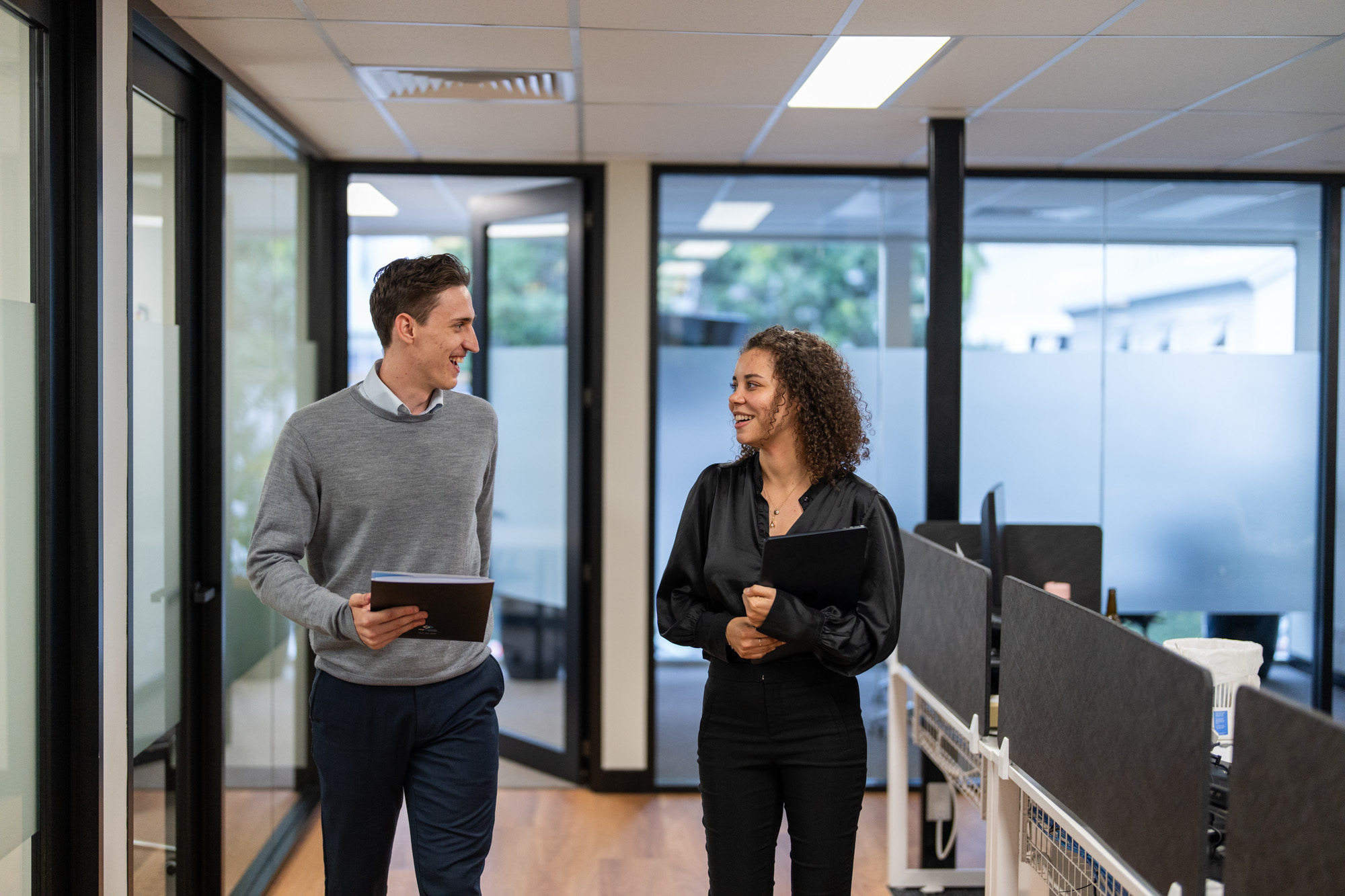 two coworkers talking at the office