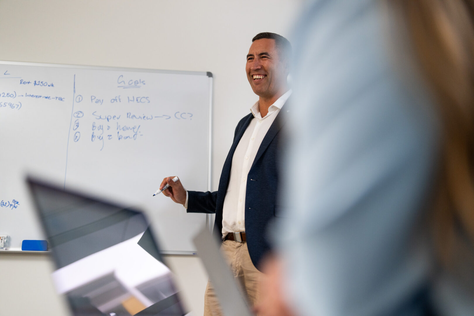 man in meeting room smiling