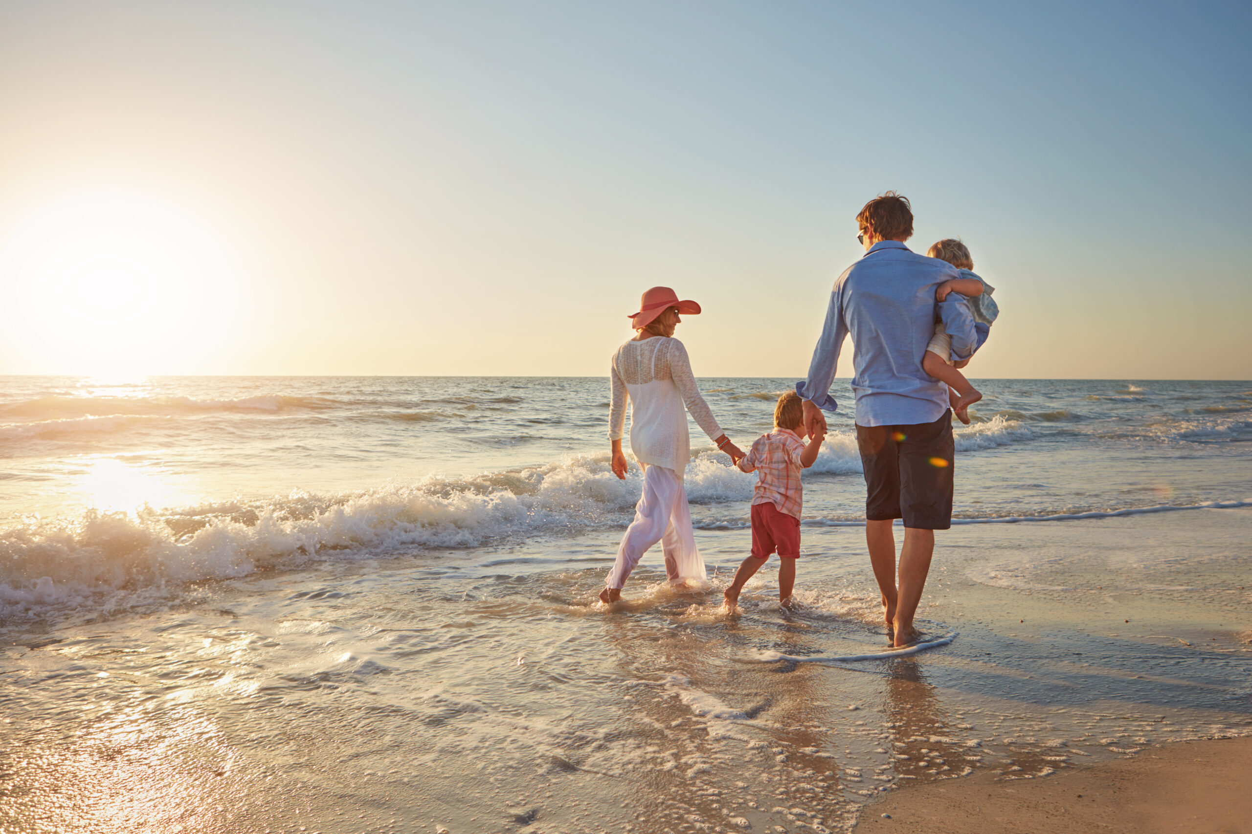 Shot of a young family enjoying a day at the beach