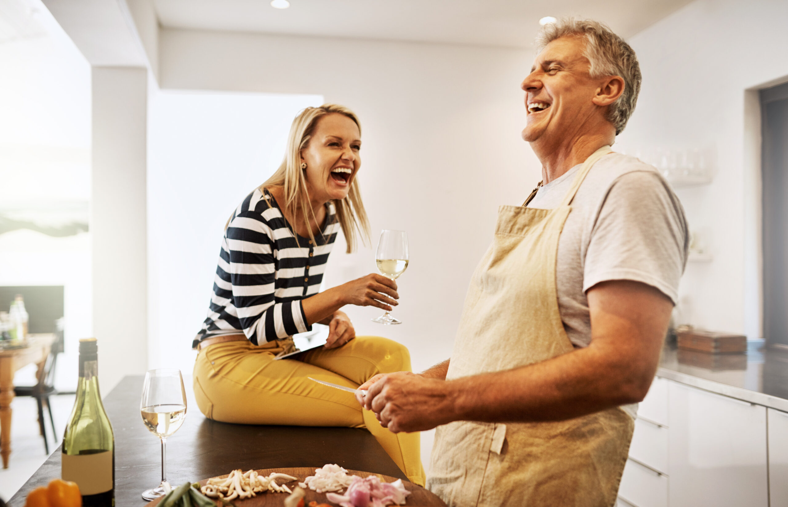 Shot of a happy mature couple keeping each other company in the kitchen