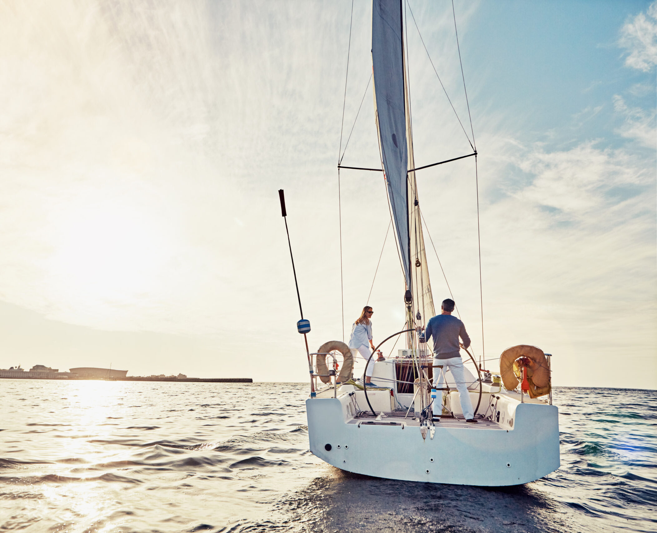 Shot of a couple out sailing on a yacht
